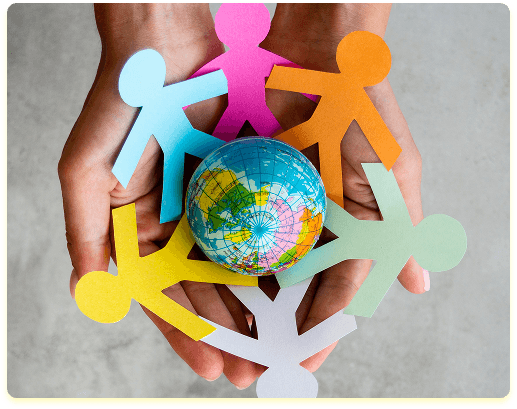 Hands holding colorful paper cutouts around a globe